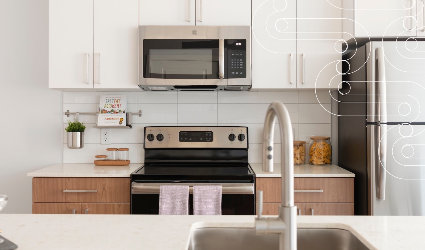 Beautiful kitchens with designer finishes  kitchen appliances with white cabinets J Malden Center luxury apartments for rent Malden MA