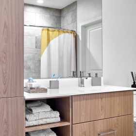 Bathroom options with thoughtful details a bathroom with wooden cabinets J Malden Center luxury apartments for rent Malden MA