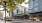 a bus driving down a street in front of property J Malden Center luxury apartments for rent Malden MA 