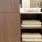 a bathroom with towels inside wooden cabinets J Malden Center luxury apartments for rent Malden MA 