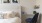 a bed and a chair in a room with a table and a chair J Malden Center luxury apartments for rent Malden MA 