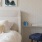 a bed and a chair in a room with a table and a chair J Malden Center luxury apartments for rent Malden MA 